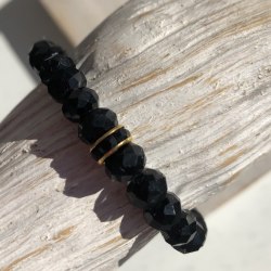 Браслет из кристаллов черный со вставкой сваровски золотого цвета